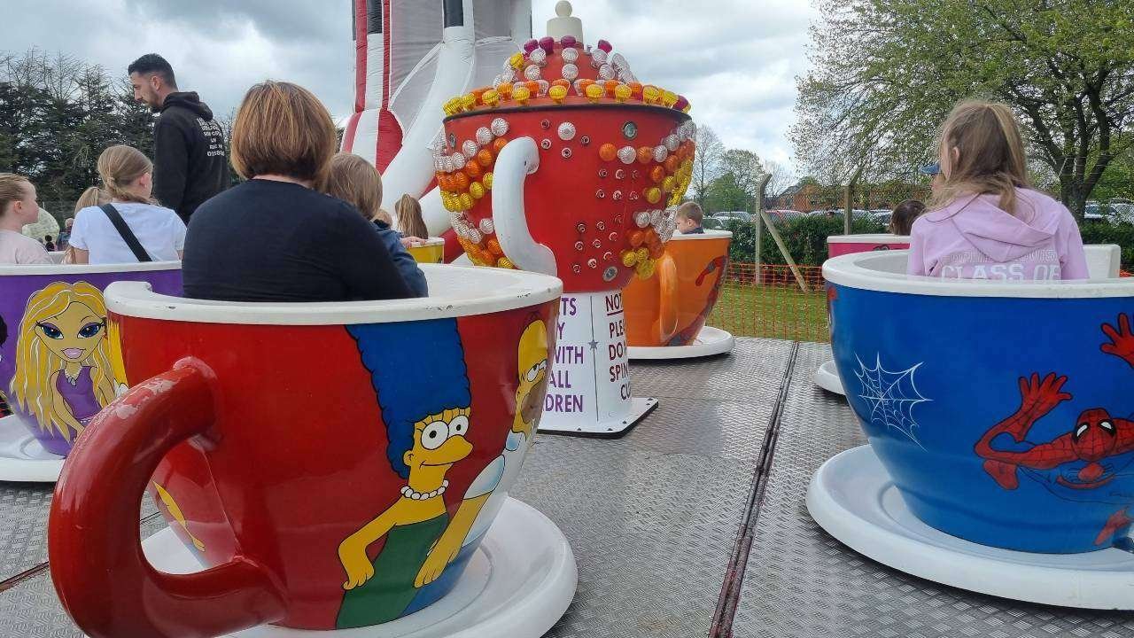 Tea Cups Ride kid having fun